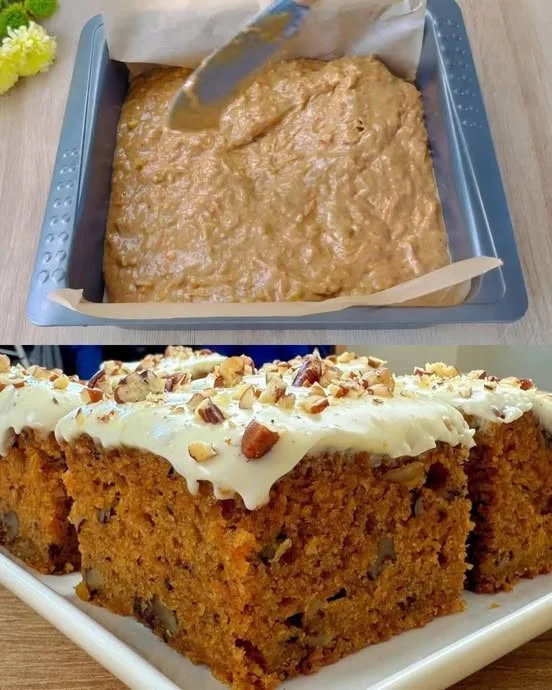 Classic carrot cake with cream cheese frosting on a decorative plate