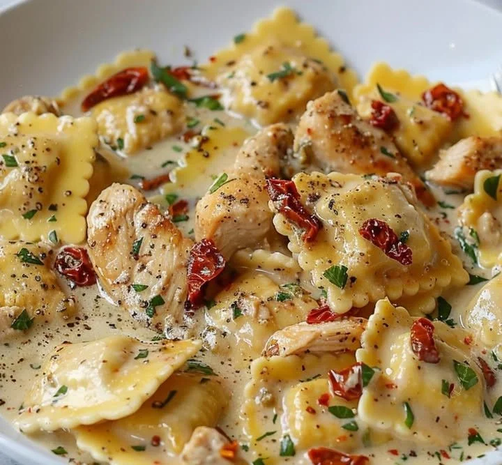 Creamy sun-dried tomato chicken served on a plate with herbs and spices